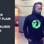 Anesu Michael Maposa wearing a personalised basketball hoodie inside an office