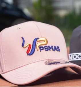 pink cap with psmas logo embroidery on the front panel in red blue and gold